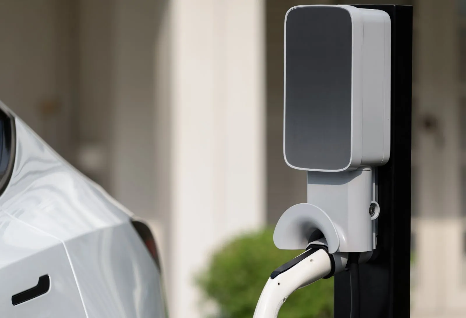 Home EV charging station on garage wall — electrical panel upgrade for EV charger North Carolina