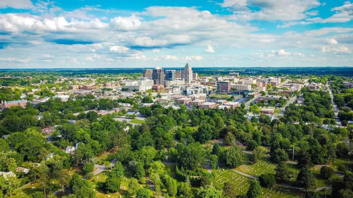 Aerial view of Greensboro, North Carolina, showing EV charger installation and solar service area