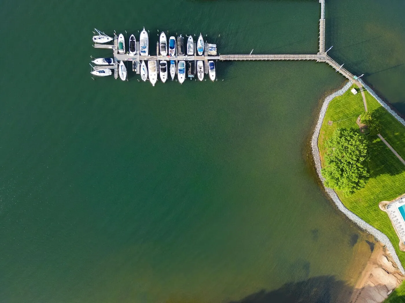 Aerial view of residential neighborhoods on Lake Norman, North Carolina — EV charger installation, solar panels, and battery storage